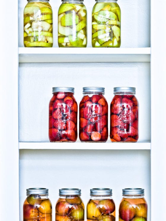 An image of a shelf of jars of fruit