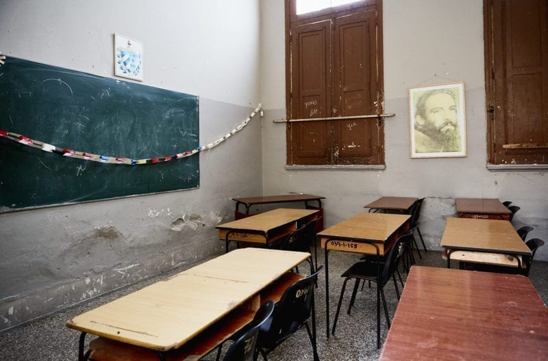 A photo of an empty classroom with desks