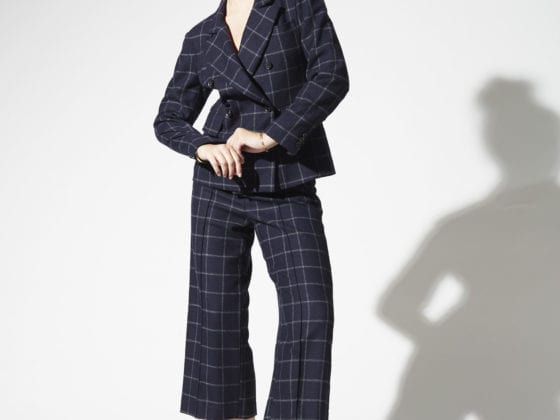 A woman in a plaid suit outfit