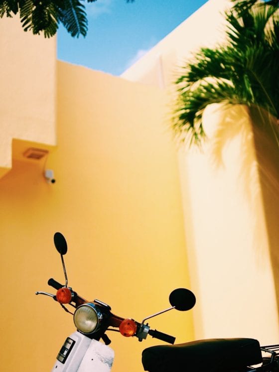 A picture of Vespa outside a building