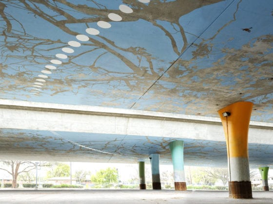 The inside of a parking garage covered in art