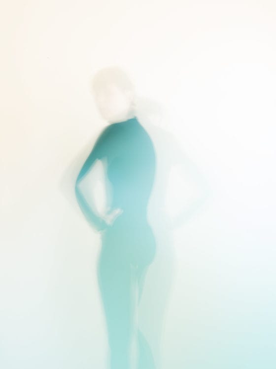 An image of a blurred silhouette of a woman