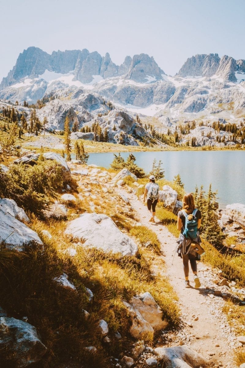 Two women backpacking through the mountains