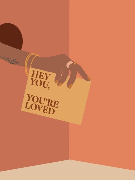 An illustration of a woman's hand holding a letter that says "Hey you, you're loved."