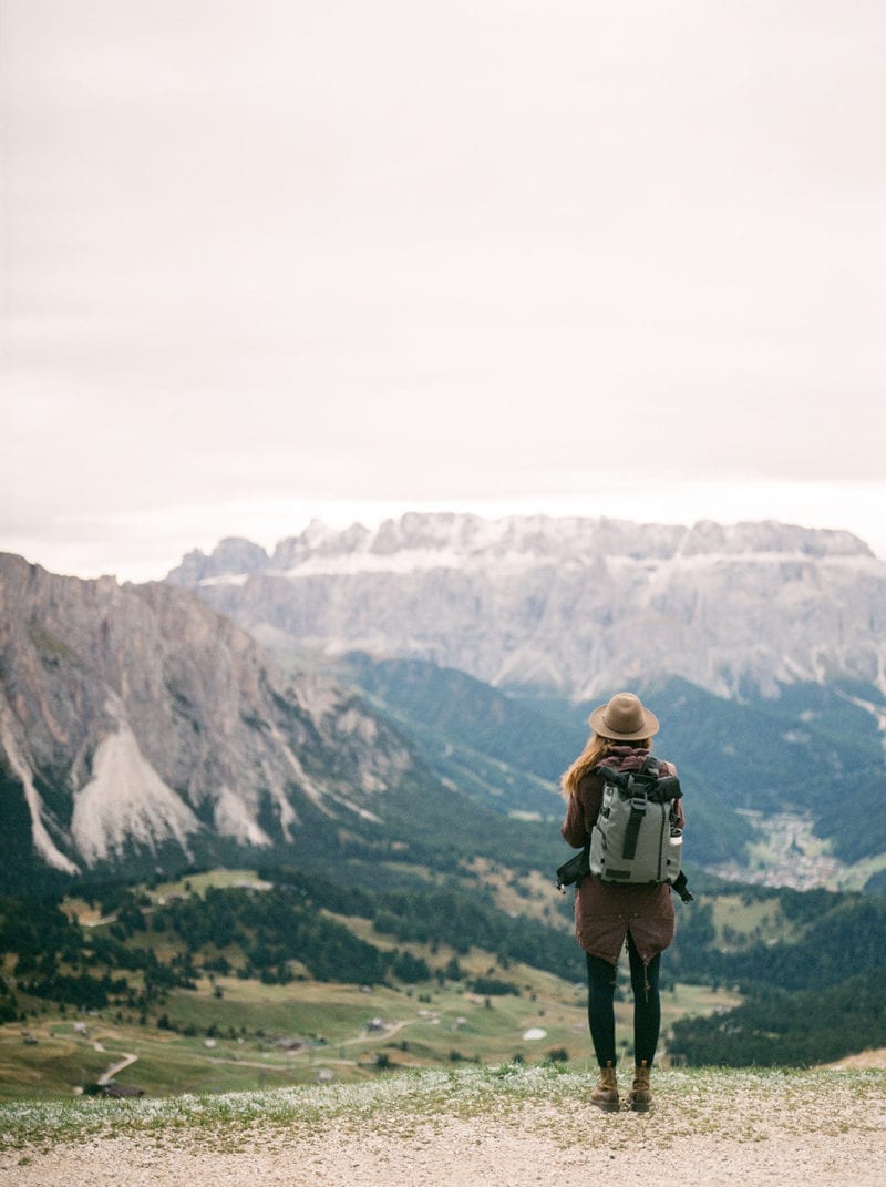 A hiker staring out at the mountains