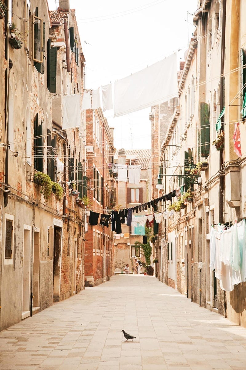 A narrow road between buildings in Italy