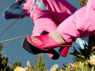 A picture of a woman with a pink shoe
